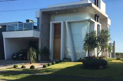 Casa em condomínio fechado com 4 quartos à venda na estrada do mar, 33, parque antártica, capão da canoa, 265 m2 por r$ 3.500.000