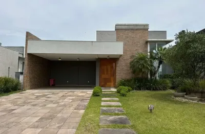 Casa em condomínio fechado com 4 quartos à venda na rua onório germano, 2009, araça, capão da canoa por r$ 1.600.000