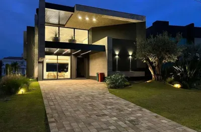 Casa em condomínio fechado com 5 quartos à venda na rua rio jacui, 1331, atlântida, xangri-lá por r$ 8.800.000