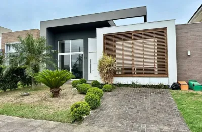 Casa em condomínio fechado com 3 quartos à venda na avenida central, 2000, zona nova, capão da canoa por r$ 1.399.000