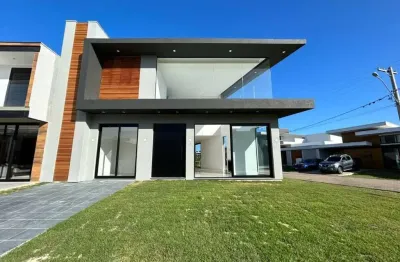 Casa em condomínio fechado com 4 quartos à venda na rua divisa, 32, centro, xangri-lá por r$ 1.590.000