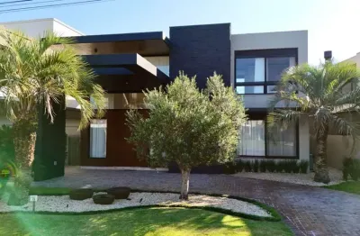 Casa em condomínio fechado com 5 quartos à venda na rua rio jacuí, 1331, atlântida, xangri-lá por r$ 4.500.000