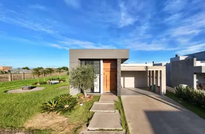 Casa em condomínio fechado com 3 quartos à venda na rua onório germano, 2009, araça, capão da canoa, 180 m2 por r$ 1.590.000