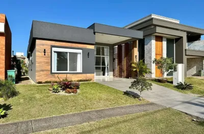 Casa em condomínio fechado com 4 quartos à venda na estrada do mar, 33, parque antártica, capão da canoa, 192 m2 por r$ 1.890.000