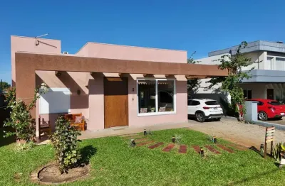 Casa em condomínio fechado com 3 quartos à venda na rua onório germano, 2009, araça, capão da canoa por r$ 1.200.000