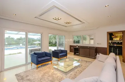 Casa em condomínio fechado com 4 quartos para alugar na avenida juca batista, 8000, cavalhada, porto alegre, 445 m2 por r$ 30.000