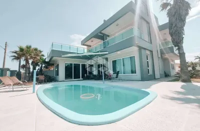 Casa mobiliada, 05 suítes, 02 vagas, piscina, em atlântida, xangri-lá/rs