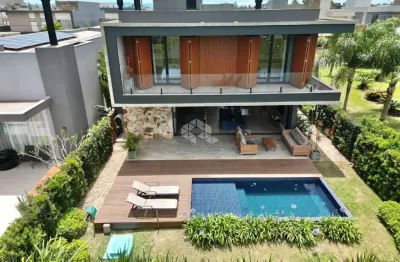 Sobrado à venda, com 4 quartos/dormitórios, 4 vagas/box, no condomínio sea coast, xangri-lá/rs