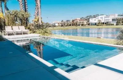 Casa com 4 suítes e piscina no condomínio bosques de atlântida