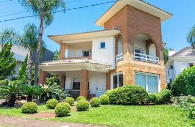 Casa com 4 dormitórios e duas suítes em condomínio em atlântida