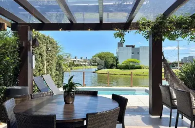 Casa condomínio rossi atlântida 04 dormitórios, 04 suítes 02 vagas, beira lago