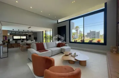 Casa em condomínio fechado com 4 quartos à venda na rua rio novo, 2000, centro, xangri-lá, 194 m2 por r$ 2.600.000