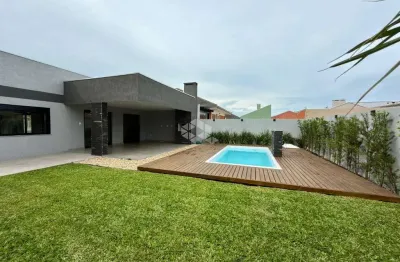 Casa em atlântida sul, 03 dormitórios, 01 suíte várias vagas