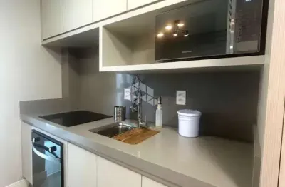 Apartamento com 2 dormitórios sendo 1 suíte e 1 vaga de garagem em itapema