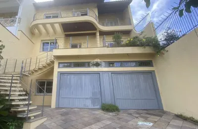 Casa com 5 quartos à venda na Rua Isidoro Tressi, 507, Jardim Botânico, Porto Alegre