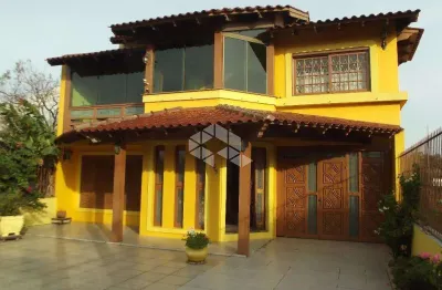Casa com 4 quartos à venda na Rua Marquês do Maricá, 505, Vila Nova, Porto Alegre