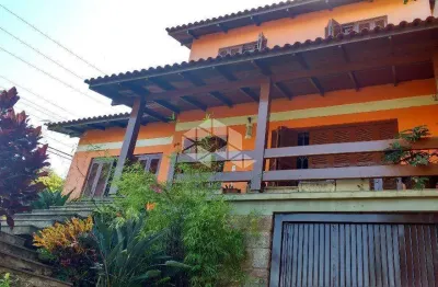 Casa com 5 quartos à venda na Rua Ângelo Passuelo, 79, Vila Nova, Porto Alegre