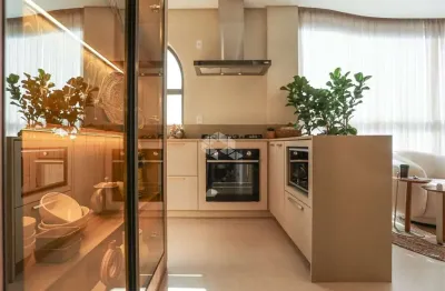 Apartamento mobiliado com três quartos na meia praia em itapema sc