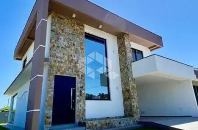 Casa em condomínio fechado à venda em camobi  com 3 suítes