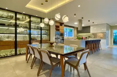 Casa de alto padrão à venda no condomínio quintas do lago em canoas - 4 dormitórios, 3 suítes, mobiliada, pé-direito duplo e piscina aquecida