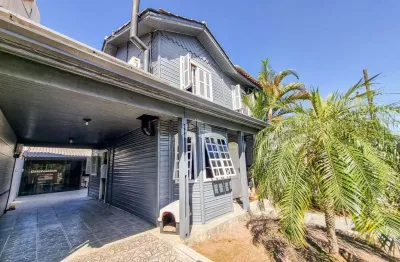 Casa à venda no bairro igara em canoas, 3 dormitórios, salão de festas, piscina e 3 vagas - aceita financiamento e fgts