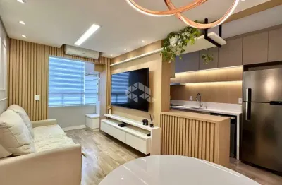Apartamento 2 dormitórios, sala, mobiliado, cozinha americana, 1 vaga, elevador, piscina, escritório, sacada com churrasqueira. no bairro vila rosa