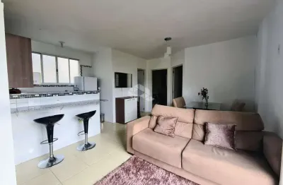 Apartamento com 2 dormitórios, 1 banheiro, 1 vaga de garagem, cozinha americana, mobiliado