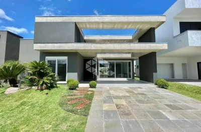 Casa térrea com 4 suítes em condomínio fechado de capão da canoa