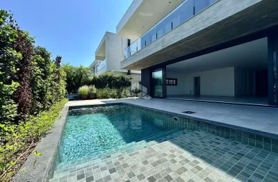 Casa no condomínio capão ilhas com 5 suítes e piscina, nunca habitada