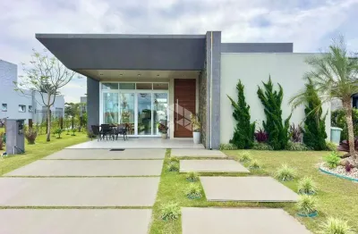 Casa térrea com 3 suítes mobiliada e decorada com vista para o lago no condomínio dubaí em capão da canoa