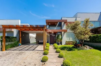 Casa térrea com 3 suítes próxima a toda infra no condomínio condado de capão da canoa