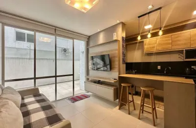 Apartamento de 2 dormitórios mobiliado com terraço em 'l'  e box/vaga de garagem na zona nova em capão da canoa