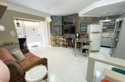 Apartamento de 1 dormitório c/ terraço mobiliado e com box de garagem no centro de capão da canoa