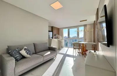 Apartamento de 2 dormitório mobiliado e decorado com acabamento em alto padrão com box/vaga de garagem na zona nova em capão da canoa