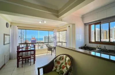 Apartamento de 3 dormitórios com vista mar mobiliado com box/vaga de garagem no centro de capão da canoa