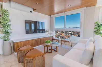 Apartamento com 2 suítes mobiliado e decorado com box/vaga de garagem no centro de capão da canoa