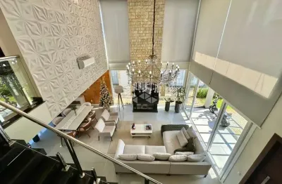 Sobrado com 4 dormitórios (sendo 3 suítes) a beira lago no condomínio fechado capão ilhas