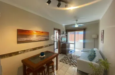 Apartamento de 1 dormitório mobiliado c/ churrasqueira box de garagem + depósito no centro de capão da canoa