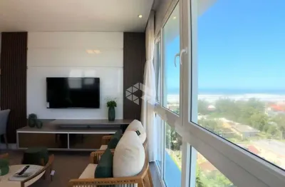 Apartamento de 3 dormitórios mobiliado e decorado, com vista para mar e serra no bairro navegantes em capão da canoa
