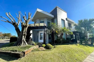 Sobrado com 6 dormitórios, 8 banheiros + dependência de empregada  e elevador no condomínio fechado condado de capão