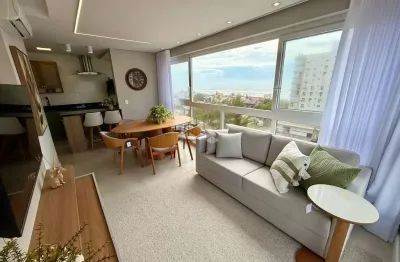Apartamento de 3 dormitórios, mobiliado e decorado, vista para o mar e com box/vaga de garagem na zona nova em capão da canoa