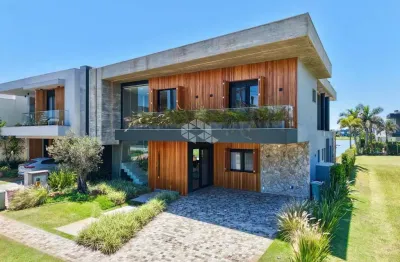 Casa com 4 suíte, mobiliada e decorada e com linda vista para o lago no condomínio fechado capão ilhas resort em capão da canoa