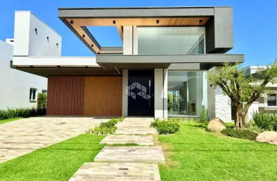 Casa alto padrão com 4 suítes idependentes condomínio fechado dubaí em capão da canoa