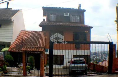 Casa com 4 quartos à venda na Rua Fernando Osório, 740, Teresópolis, Porto Alegre
