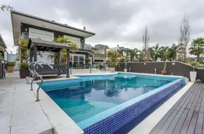 Casa em condomínio com 4 quartos, sendo 4 suítes, 506m², 4 vagas no bairro terra ville porto alegre
