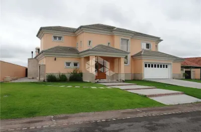 Casa em condomínio com 4 quartos, sendo 4 suítes, 506m², 4 vagas no bairro terra ville porto alegre
