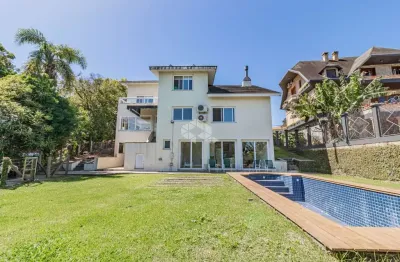 Casa em condomínio fechado com 4 quartos à venda na Avenida Firmino Octávio Bimbi, 255, Cavalhada, Porto Alegre