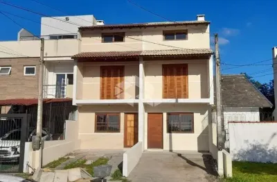 Casa com 3 quartos à venda na Rua Waldemar da Silva Tavares, 210, Guarujá, Porto Alegre