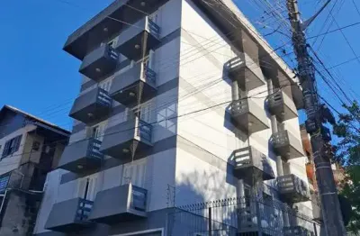 Apartamento com três dormitórios (sendo uma suíte) com duas vagas de garagem