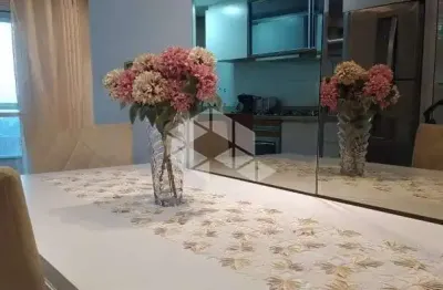 Apartamento Semimobiliado à venda no Bairro Bela Vista, Com dois dormitórios, duas vagas e sacada com churrasqueira.